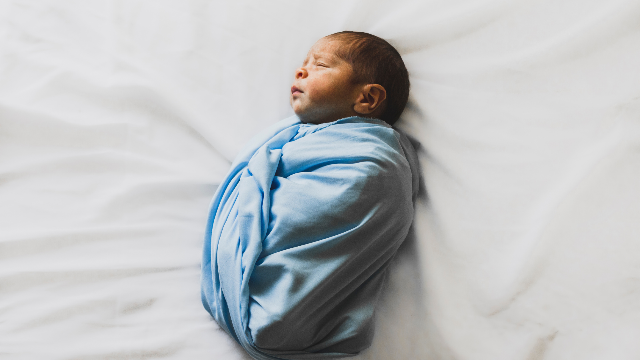 Baby Sleeping in Blue Blanket